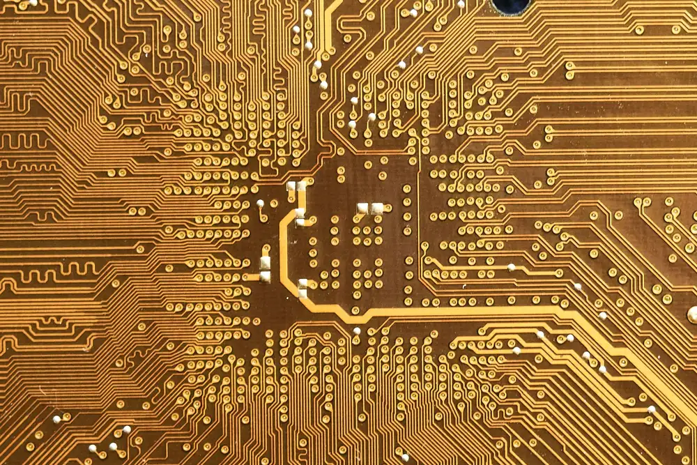 Close-up of a copper-coloured printed circuit board